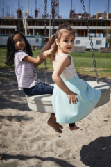 Children on a tire swing in Sandlewood Park Sandlewood Park, Herongate